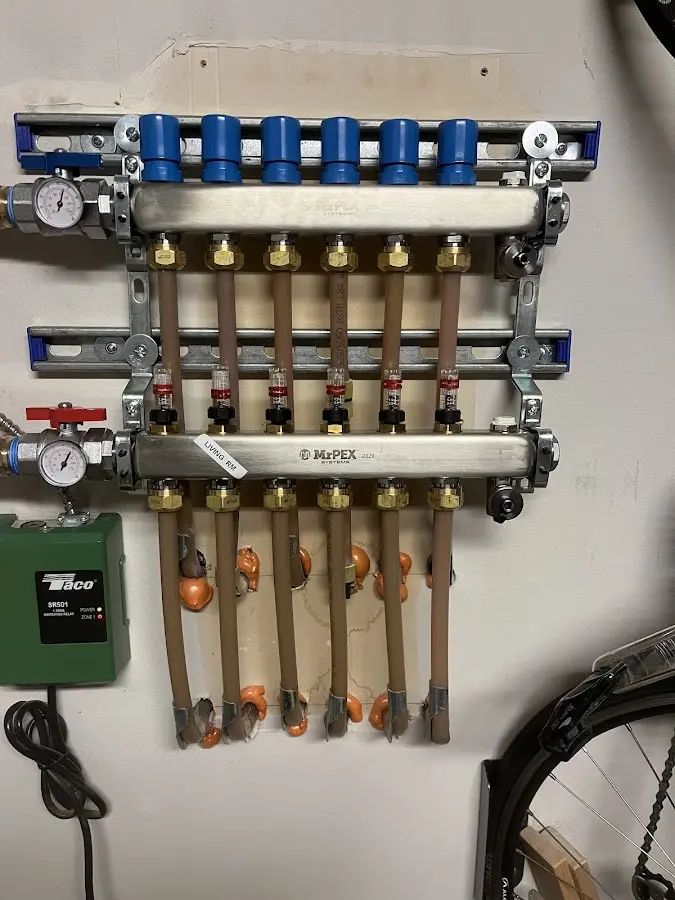 Plumber performing Water Heater Repair at a residential property in Lenoir